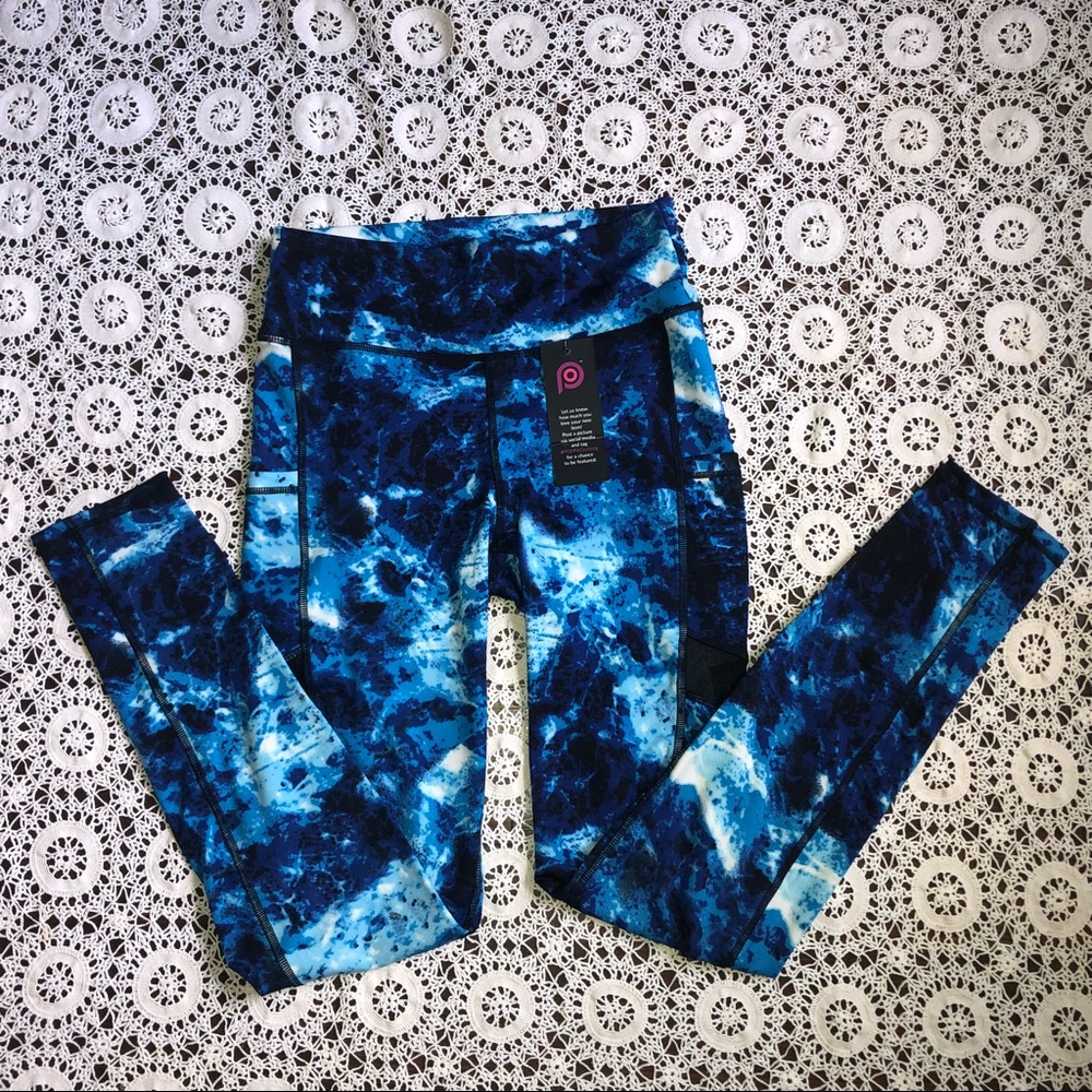 Blue patterned athletic leggings with mesh detail